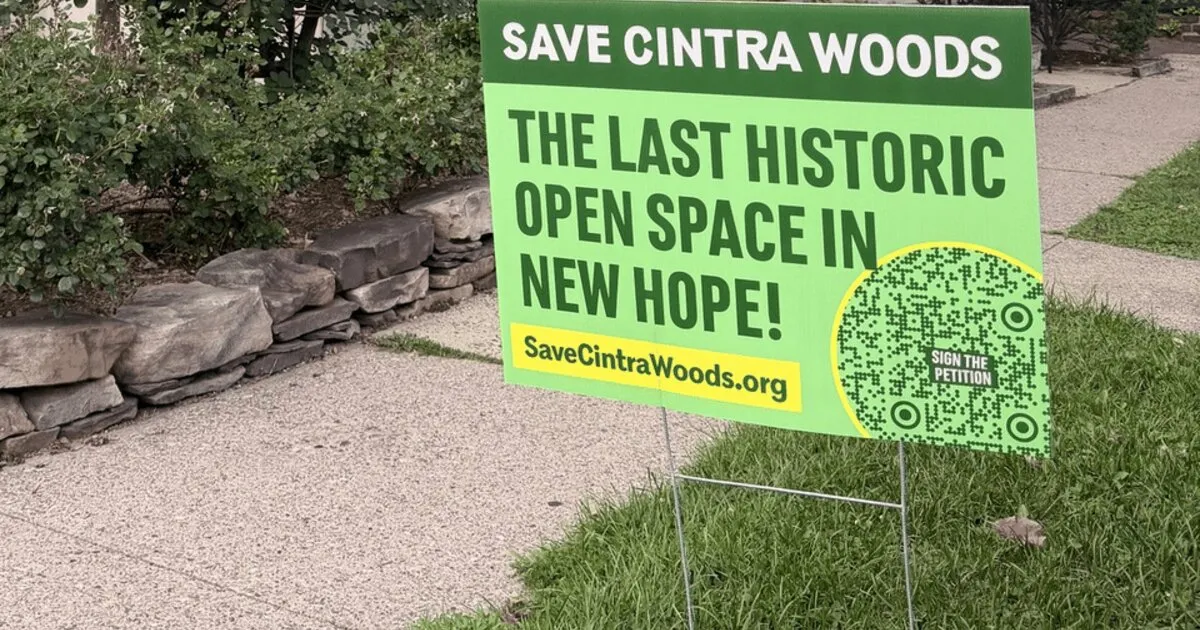 Save Cintra Woods lawn sign in a front yard in New Hope, Pennsylvania